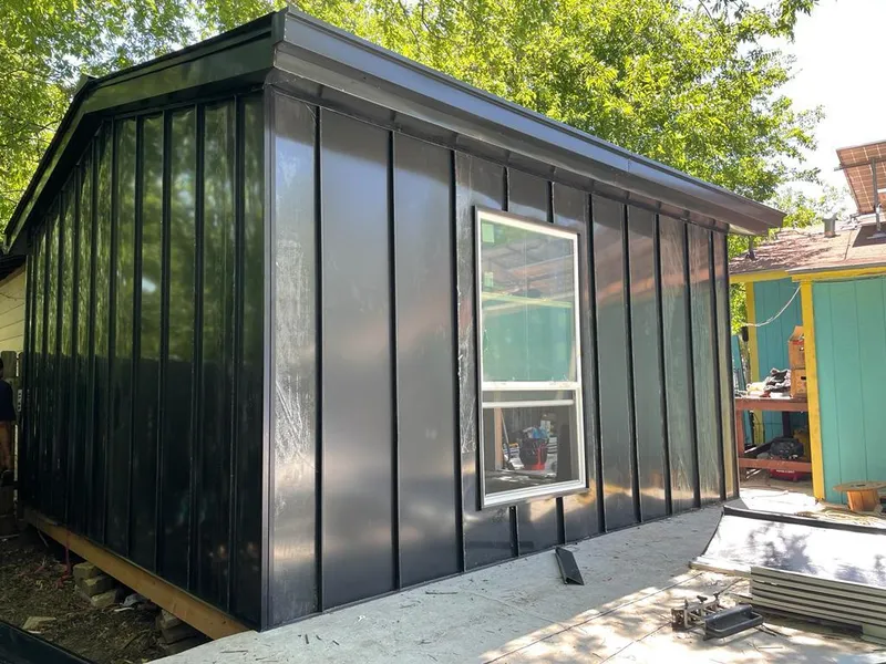 Black standing seam metal wall panels for Roof Inspection in Bulverde