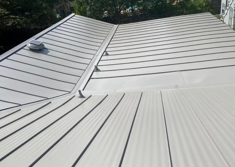 Solar attic fan installed on a metal roof for Roof Ventilation in Bulverde